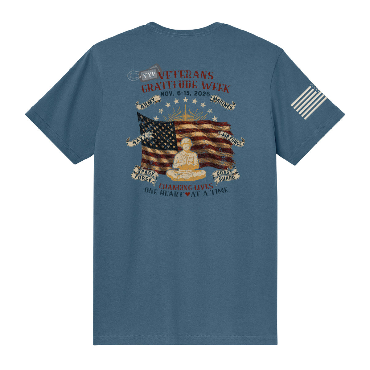 An indigo tee with a vintage patriotic graphic on the back celebrating Veterans Gratitude Week, 2026.