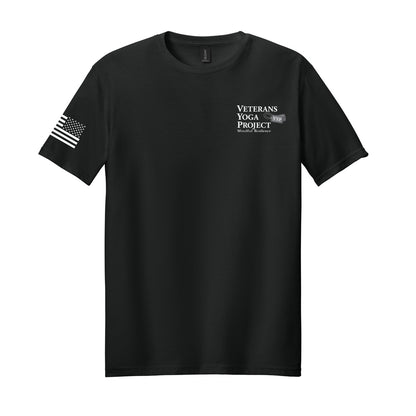 Black t-shirt with 'Veterans Yoga Project' logo on the left chest and a charging American flag in white on black on the right sleeve.